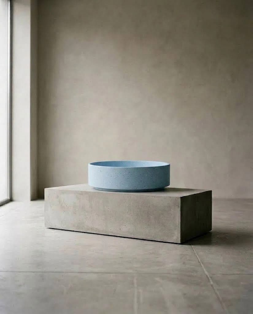 Powder-blue BB vessel basin on a concrete plinth