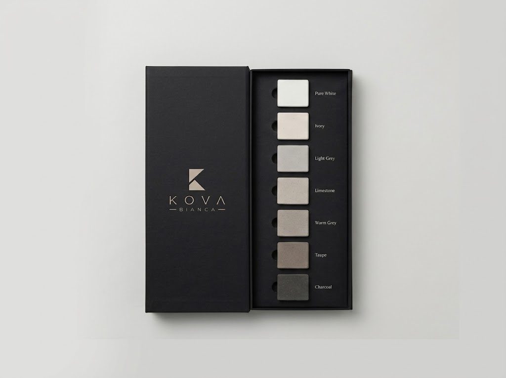 KOVA BIANCA architectural sample box open, showing seven labeled tone swatches